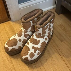 Cow print mini UGGs